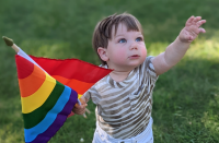 Enzo Bernardo holding a Pride flag